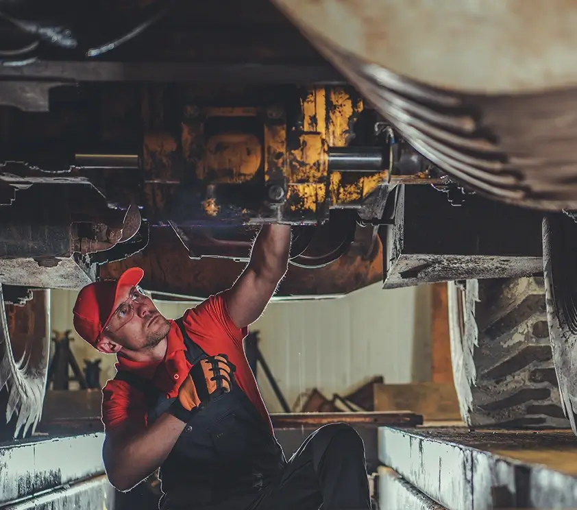 Service tech working on machine
