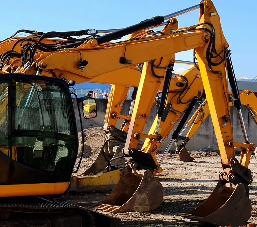 Mini excavators at work site